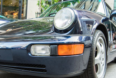 Close-up of vintage car on street