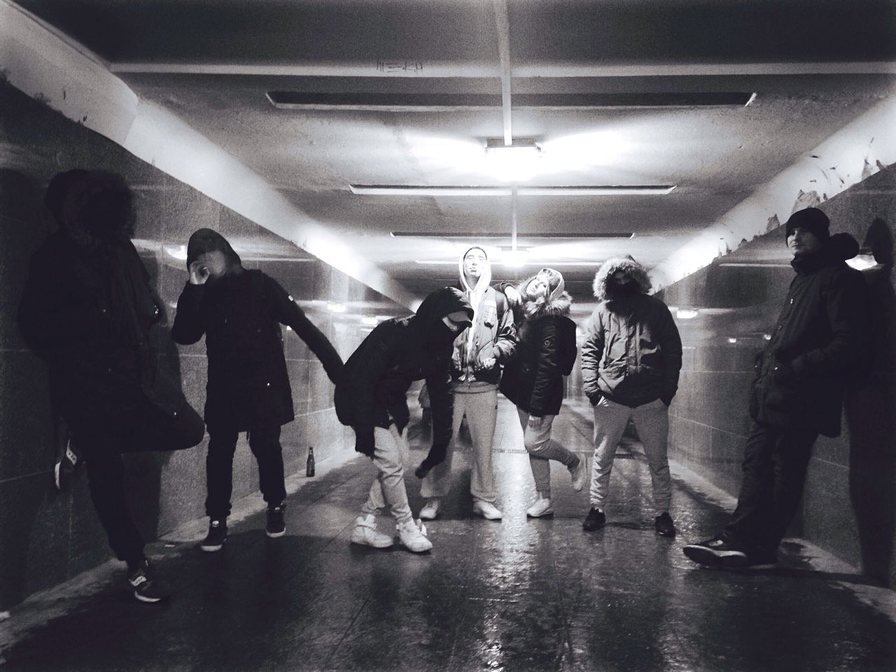 full length, lighting equipment, subway station, men, indoors, women, tunnel, illuminated, people, large group of people, adult, adults only, day