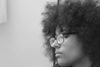 Close-up of young woman with curly hair