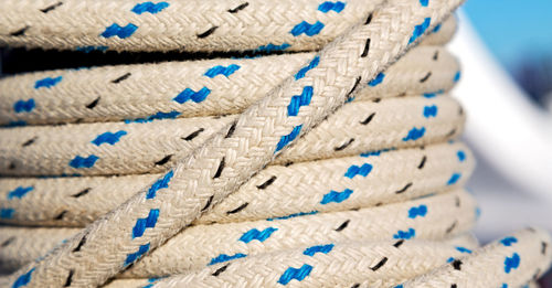 Close-up of rope on blue wall