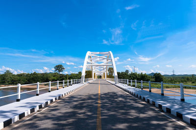 Footbridge against blue sky