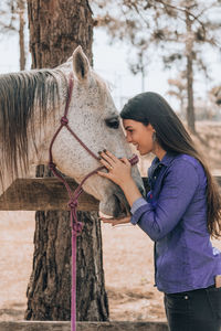 Side view of woman wearing hat outdoors
