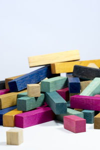 Close-up of multi colored pencils against white background