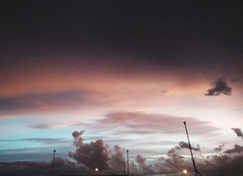 Low angle view of silhouette trees against sky at sunset