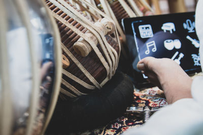 Midsection of man using mobile phone