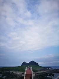 View of road against cloudy sky