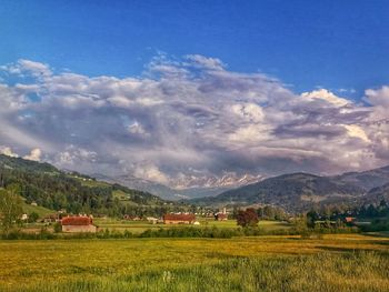 Scenic view of agricultural field against sky