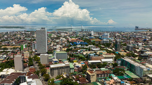 Panorama of cebu city with tall buildings. cebu cordova link expressway. philippines.