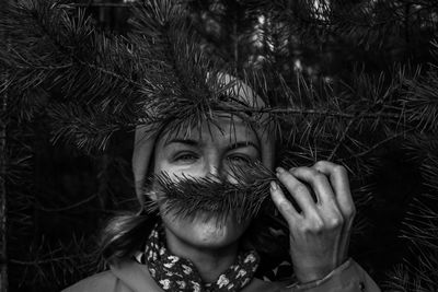 Portrait of woman with plants in park