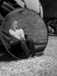 Portrait of woman sitting on seat