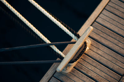 High angle view of rope tied on wood