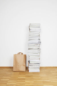 Stacked magazines, paper bag, waste paper