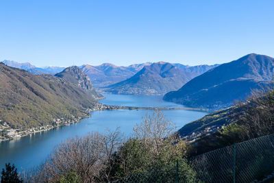 The view to the lake lugano and the surrounding mountains from serpiano, ticino, switzerland