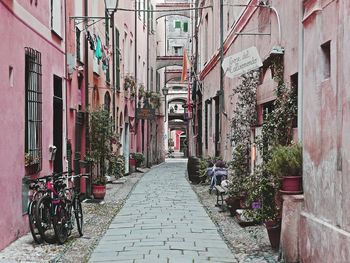 Narrow alley amidst buildings in city