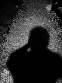 Shadow of person on footpath