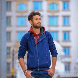 Young indian beard boy standing facing the sunlight