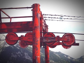 Low angle view of cables against sky