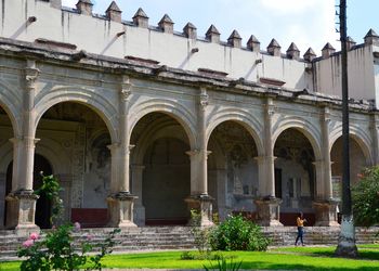 Facade of historic building against sky