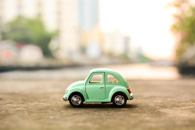 Close-up of toy car on road