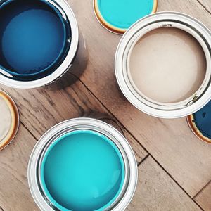 Directly above shot of paint cans on table