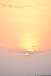 Scenic view of sea against romantic sky at sunset