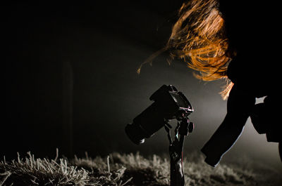 Close-up of photographer at night