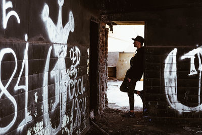 Man standing in abandoned building