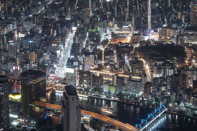 High angle view of illuminated cityscape at night