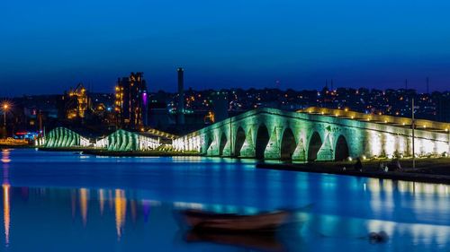 Reflection of illuminated buildings in water