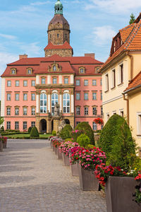 View of buildings against cloudy sky