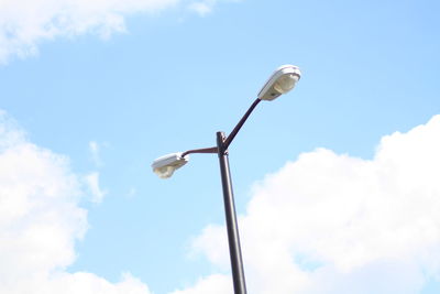 Low angle view of windmill against sky