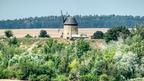 Built structure on landscape against sky