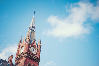 Low angle view clock tower against sky