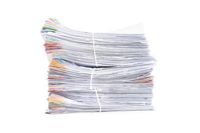 Stack of paper against white background