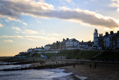 View of beach against cloudy sky