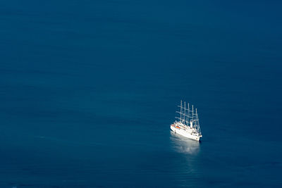 Aerial view of sailboat sailing in sea
