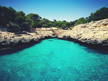 Scenic view of sea against clear blue sky