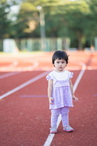 Full length of cute baby boy standing outdoors