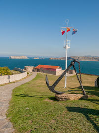 Scenic view of sea against clear blue sky