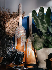 Close-up of shoes on table against wall at home