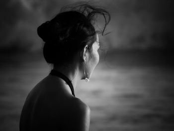 Portrait of woman looking away outdoors