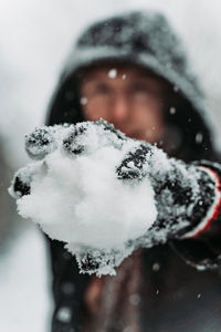 Close-up portrait of snow covered man