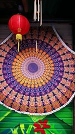 Low angle view of illuminated lanterns hanging on ceiling