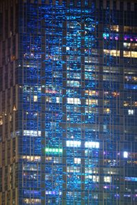 Full frame shot of illuminated modern building at night