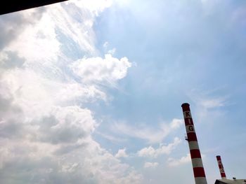 Low angle view of smoke stack against sky