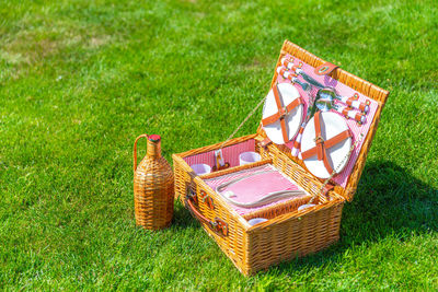 High angle view of wicker basket on field