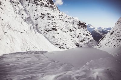 Close-up of snow covered mountain against sky