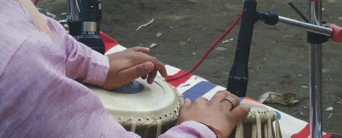 Cropped image of woman holding cigarette
