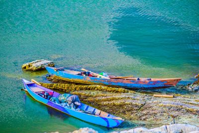 High angle view of boats moored on sea shore