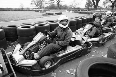 People racing on go-carts